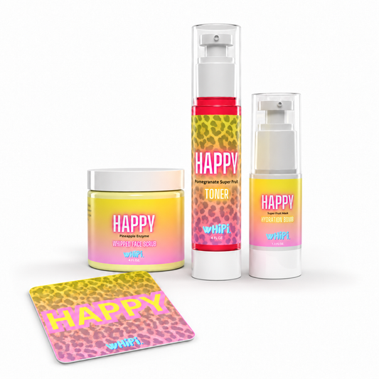 Happy skincare bundle on white: Face Scrub, 4 oz Super Fruit Toner in cheetah-label airless pump, Hydration Bomb and bonus Happy sticker.