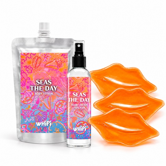 Seas The Day Body Reset: 8 oz Body Lotion, 4 oz Hair + Body Splash, and three orange lip masks on white